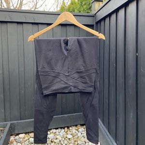 Black lululemon leggings, with mesh cut outs on bottom